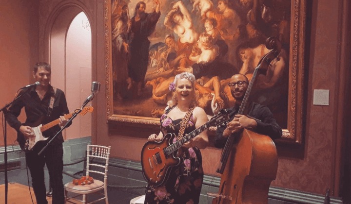 Miss Jones' rock 'n' roll trio performing in the prestigious National Gallery in London.